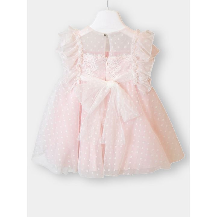 Retro dell'abito rosa a pois con il grande fiocco di tulle