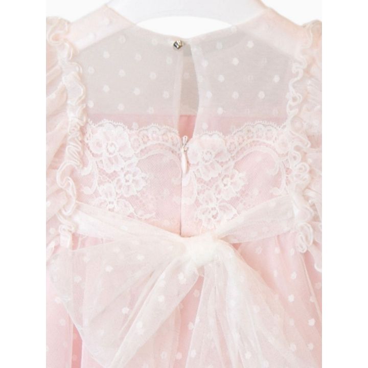 Dettaglio del retro con zip, pizzo e fiocco di tulle
