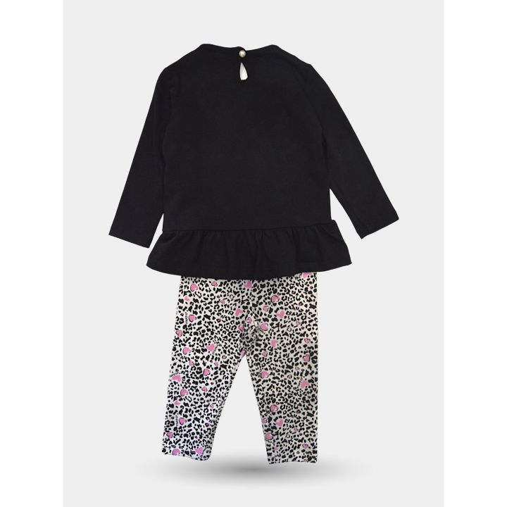 Retro del completo con bottoncino al collo e leggings maculati