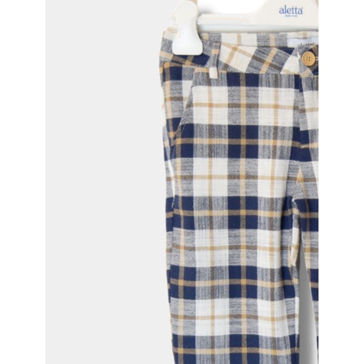 Fianco dei pantaloni a quadri blu, ecrù e senape con la tasca