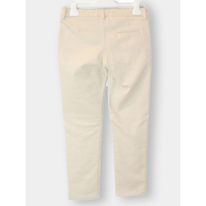 Retro dei pantaloni beige con il taschino a filetto