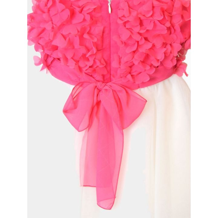 Dettaglio del fiocco fucsia trasparente e della zip sul retro