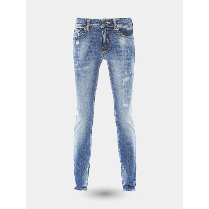 Jeans skinny Diesel blu da ragazza vista frontale con micro rotture