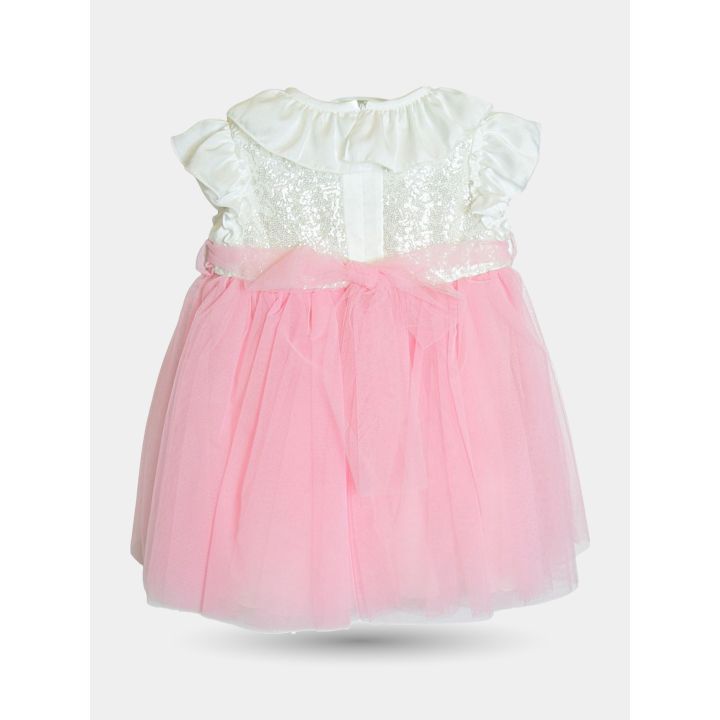 Retro dell'abito rosa in tulle con i bottoni e il fiocco in vita