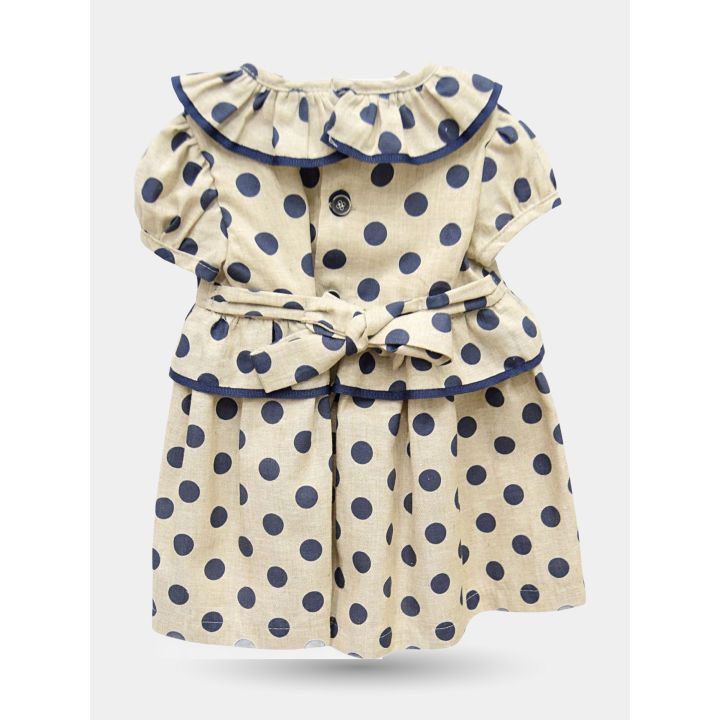 Retro del vestito a pois blu con colletto a volant e cintura annodata
