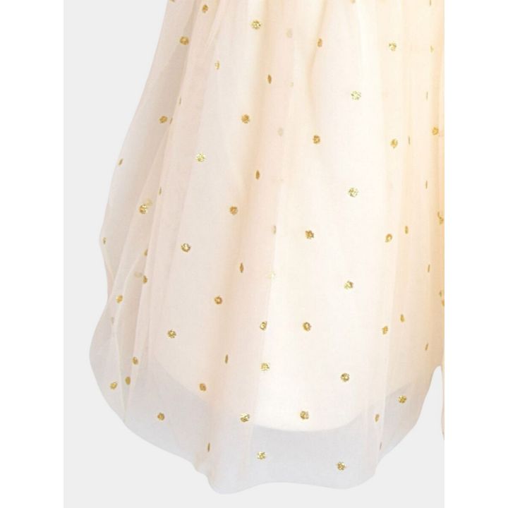 Dettaglio della gonna in tulle a pois glitter dorati