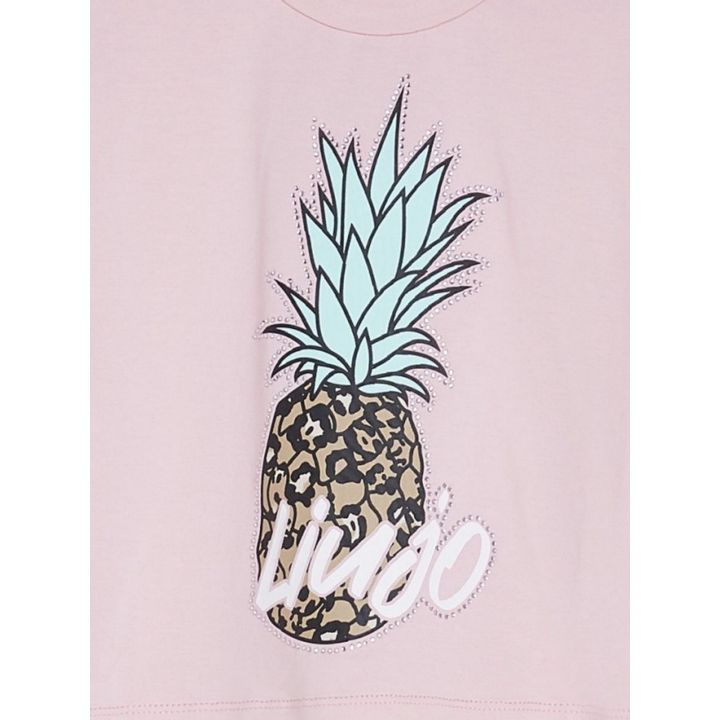 Dettaglio dell'ananas animalier con contorno di brillantini e scritta liujo