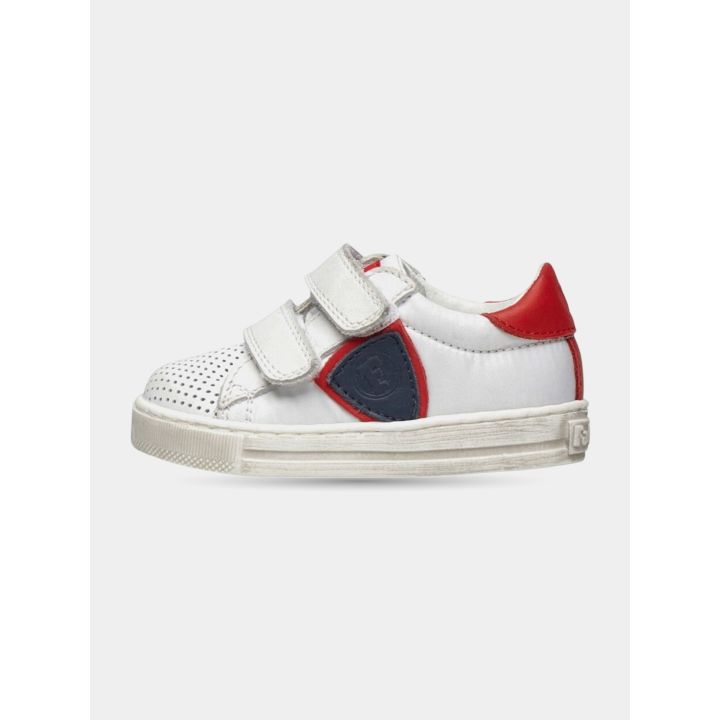 Sneakers Falcotto bianche con scudetto blu e tallone rosso, vista laterale