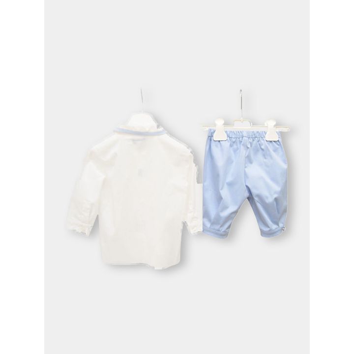Retro della camicia bianca e del pantalone lungo azzurro Aletta