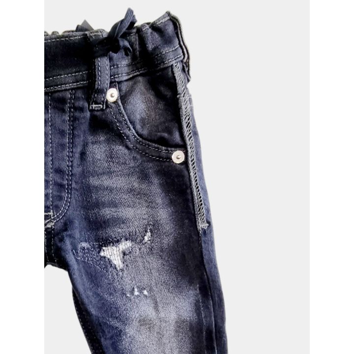 Dettaglio della vita elastica con coulisse del jeans Diesel