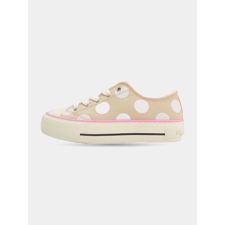 Lato interno della sneaker beige a pois con profilo rosa
