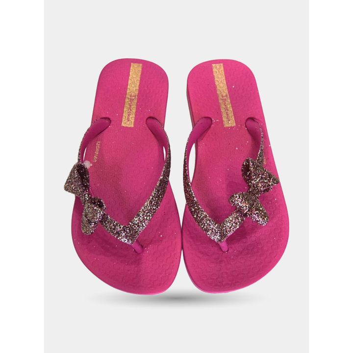 Paio di infradito Ipanema rosa con fiocchi glitter visto dall'alto