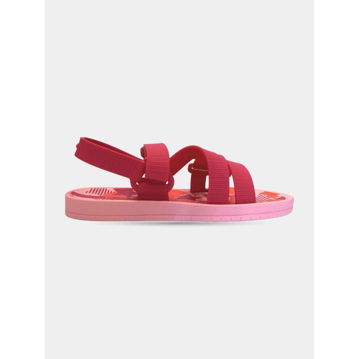 Sandalo Ipanema rosa con fasce incrociate color lampone, vista di lato
