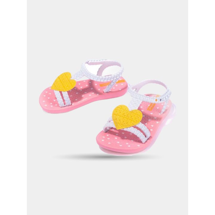 Ciabatte Ipanema rosa con cuore giallo viste di lato