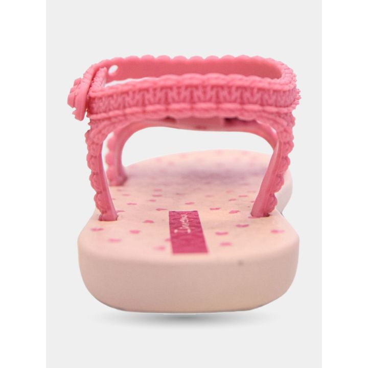 Retro della ciabatta Ipanema rosa con il cinturino alla caviglia