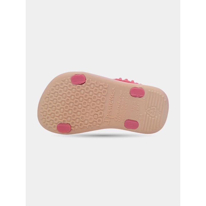 Suola della ciabatta Ipanema rosa con i tasselli e il logo