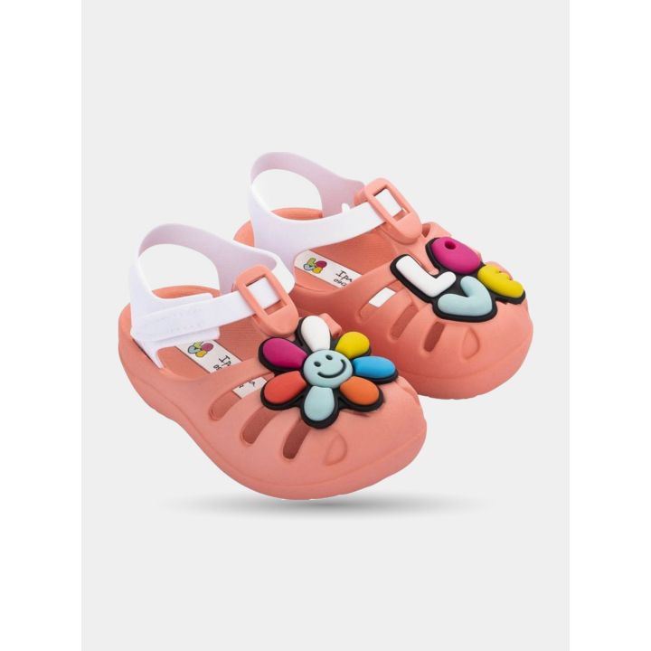 Ciabatte Ipanema bambina rosa con fiore e scritta Love, vista di tre quarti