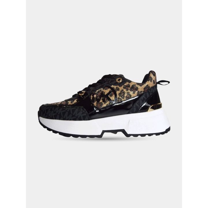 Sneakers Michael Kors nere e leopardate vista laterale con suola bianca