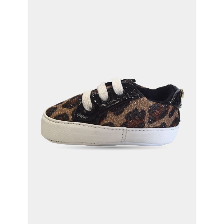 Sneakers Michael Kors maculate vista dal lato con profili neri lucidi