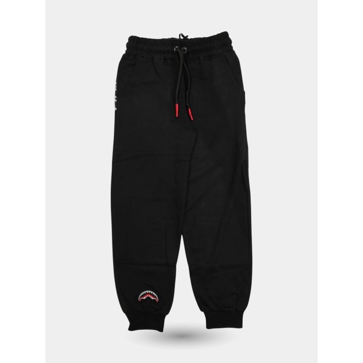 Pantalone tuta Sprayground nero vista frontale con squalo alla caviglia