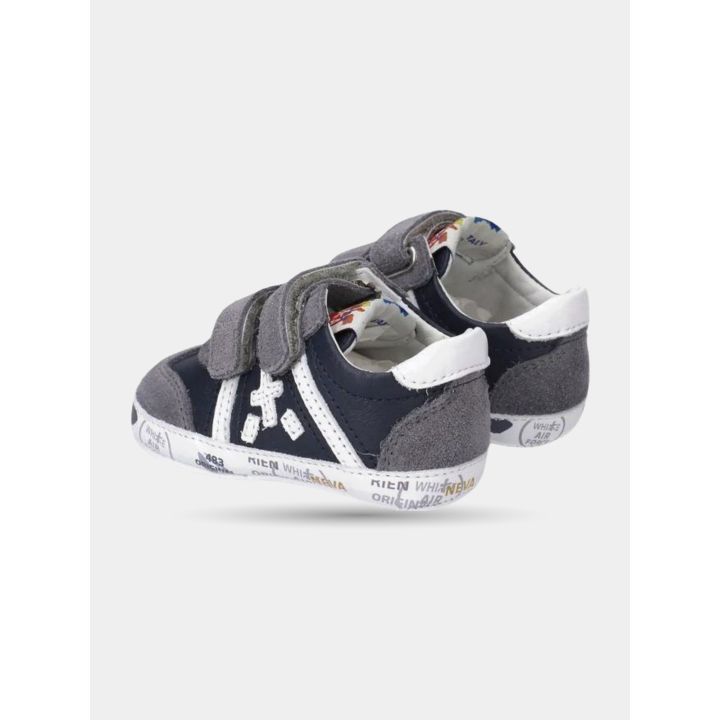 Talloni bianchi delle scarpe culla Premiata blu e grigie