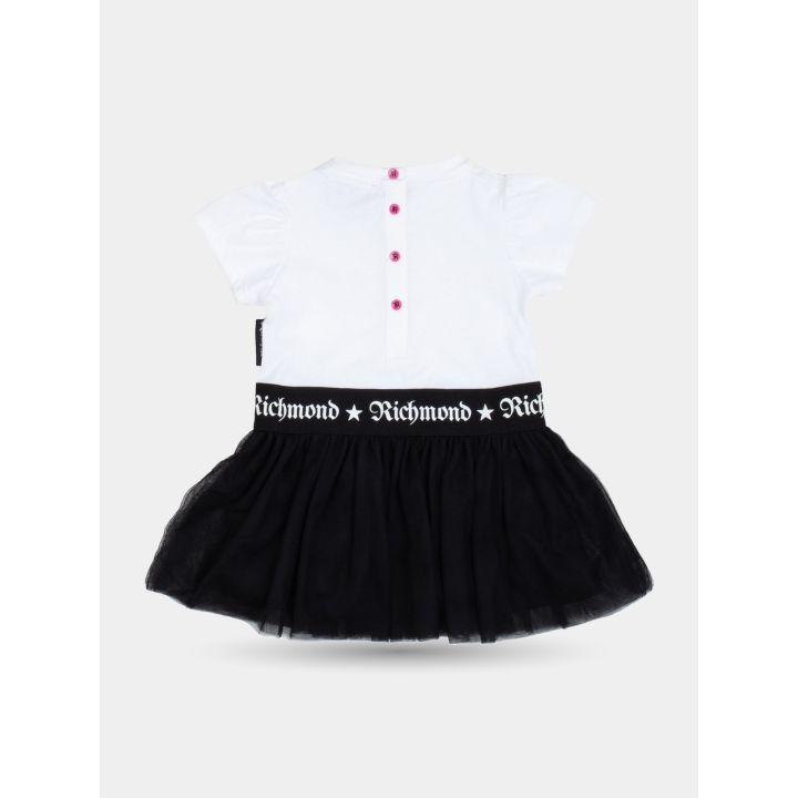 Retro dell'abito bianco e nero con bottoncini rosa e fascia logo in vita