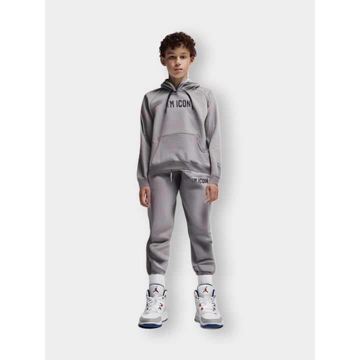 Tuta ICON grigia indossata da un ragazzo con felpa con cappuccio e pantalone