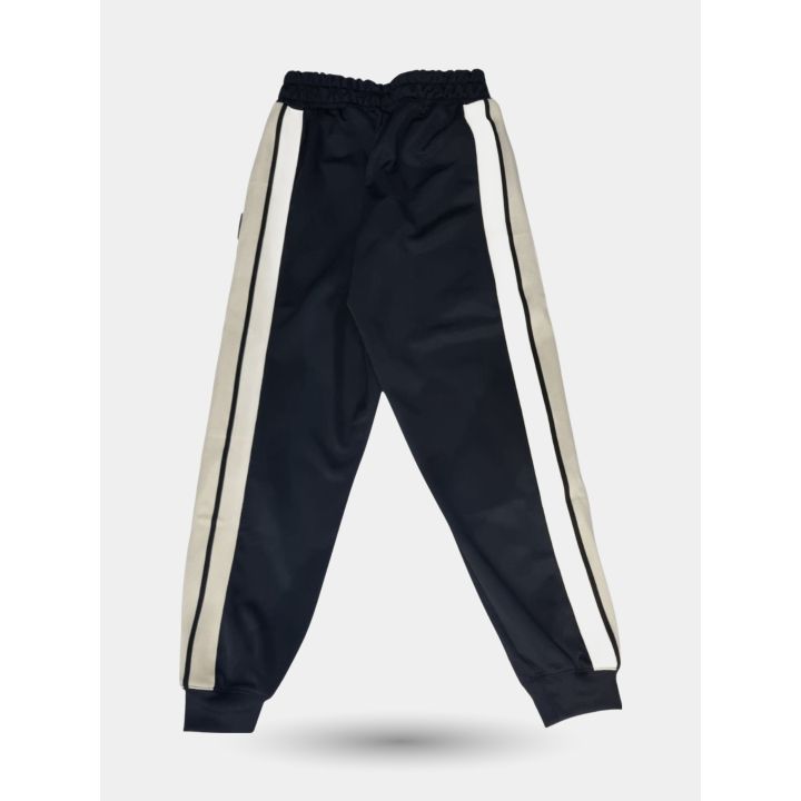 Pantalone ICON nero visto di lato con bande bianche e beige