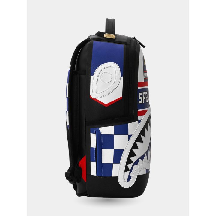 Fianco dello zaino Japan Concept con occhio bianco e scacchi blu