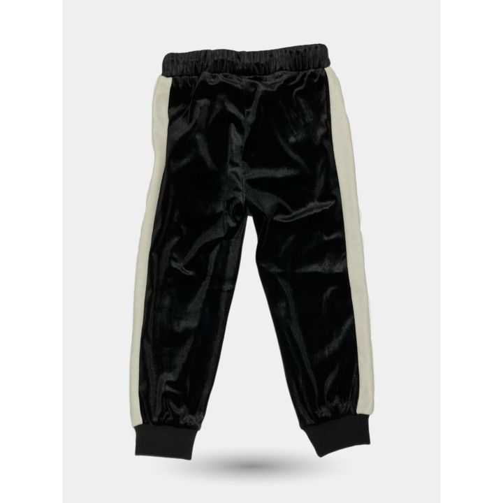 Retro dei pantaloni tuta neri con banda panna sul fianco