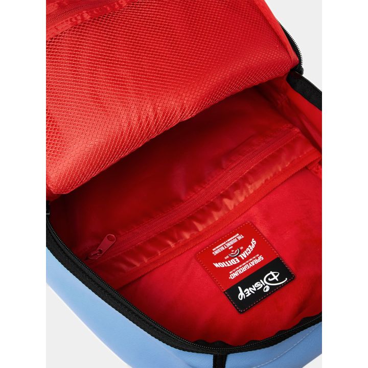 Interno dello zaino con fodera rossa ed etichetta Disney