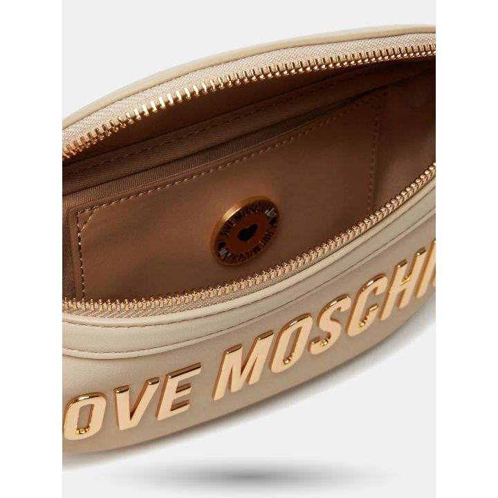 Interno del marsupio beige con zip dorata aperta