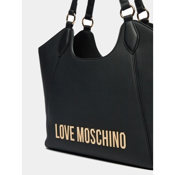 Dettaglio del logo lettering oro sulla shopper nera