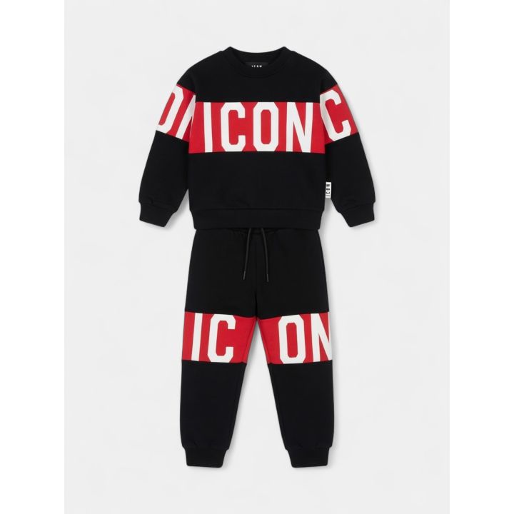 Tuta ICON nera da bambino vista frontale con fascia rossa logata