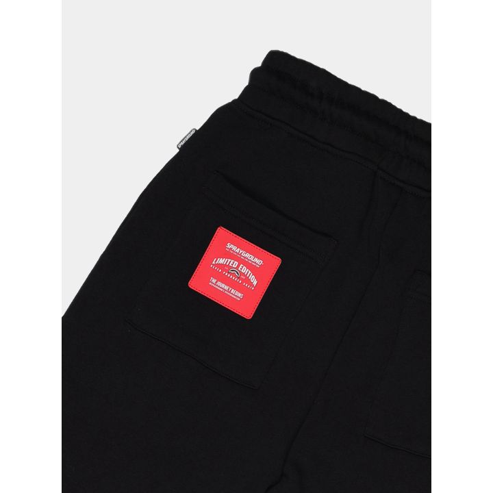 Toppa rossa effetto pelle sulla tasca dietro dei pantaloni Sprayground