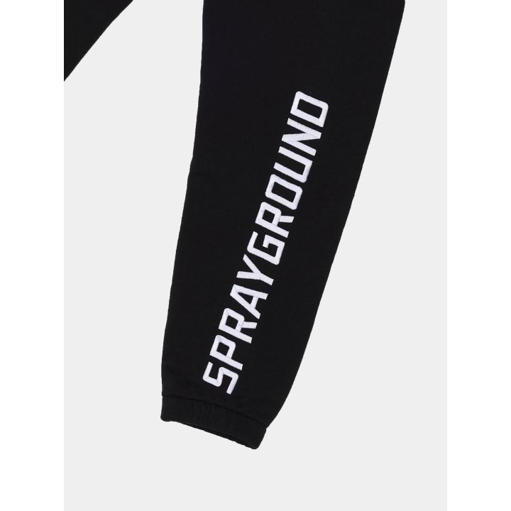 Scritta Sprayground bianca in fondo alla gamba e polsino elastico