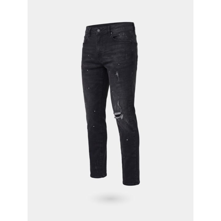 Jeans DS2 ragazzo grigio con strappi e schizzi di vernice, vista di tre quarti
