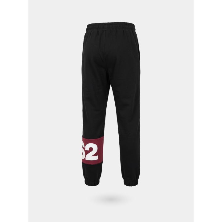 Pantalone tuta DS2 ragazzo nero con fascia rossa e logo, retro di tre quarti