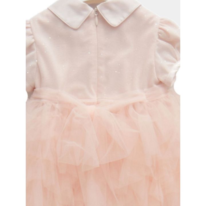 Dettaglio del retro con la zip e il tulle arricciato