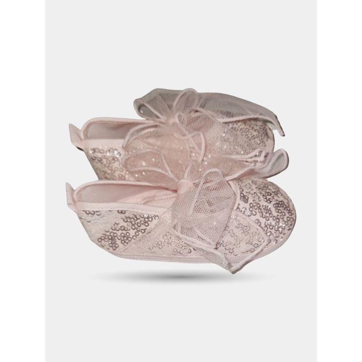 Scarpine rosa con paillettes viste di lato con il fiocco in tulle