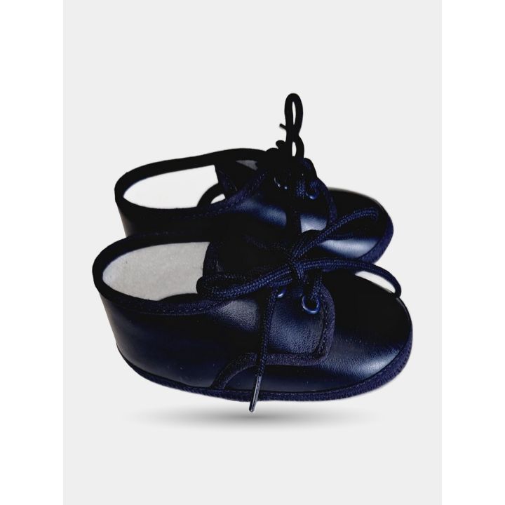Scarpina blu da neonato di profilo con interno bianco